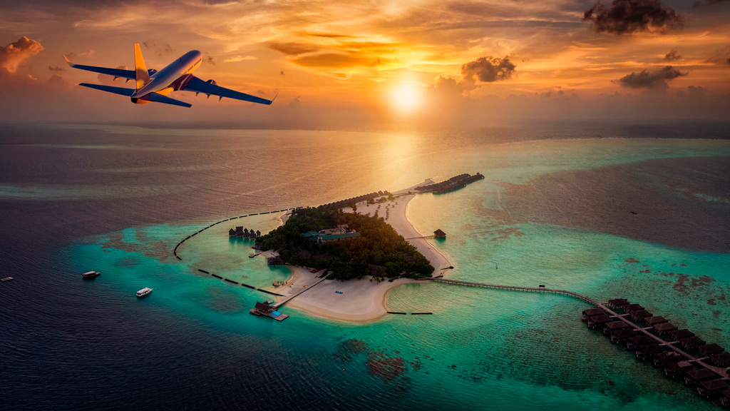 an-airplane-approaching-a-tropical-paradise-island-in-the-maldives